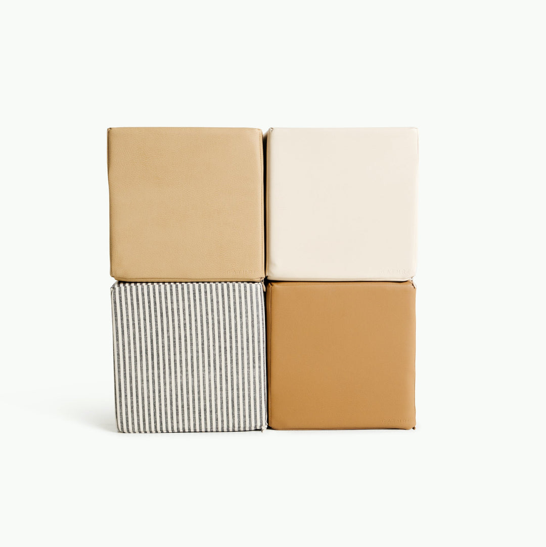 Gathre foam play cubes in wipeable vegan leather for stacking and active play.