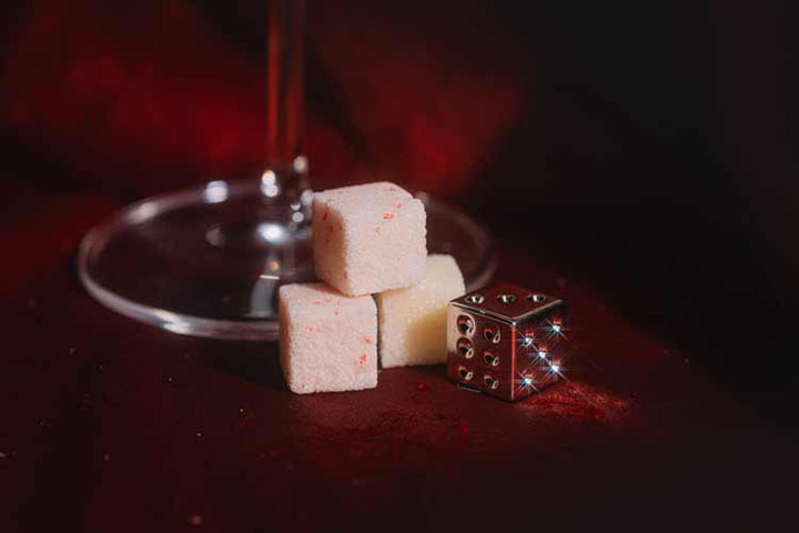 White chocolate and crushed candy cane mixer cubes for a holiday cocktail