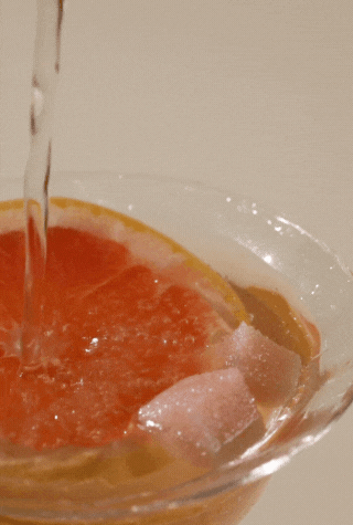 Animated Champagne Mimosa Mixer Cubes graphic showing cubes dissolving into bubbly