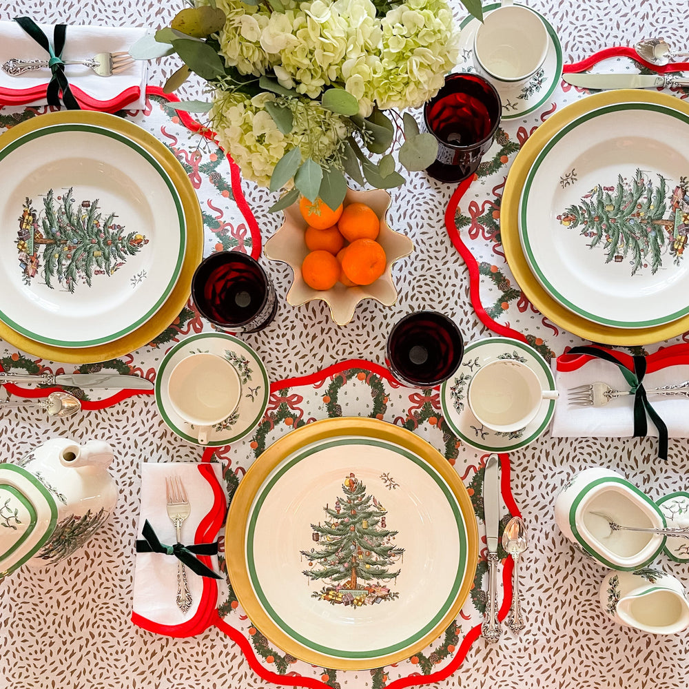 Holiday Wreath round placemat by Frances Fields Home in Rosebud Red