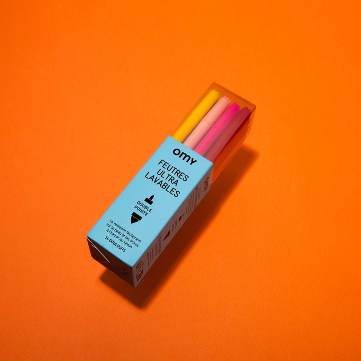 Boxed set of ultra-washable kids' markers on an orange background