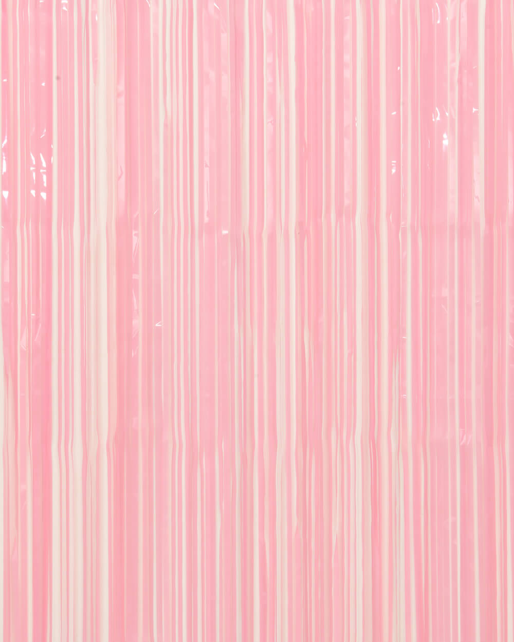 Close-up of matte pink foil fringe strands showing the soft non-glare finish