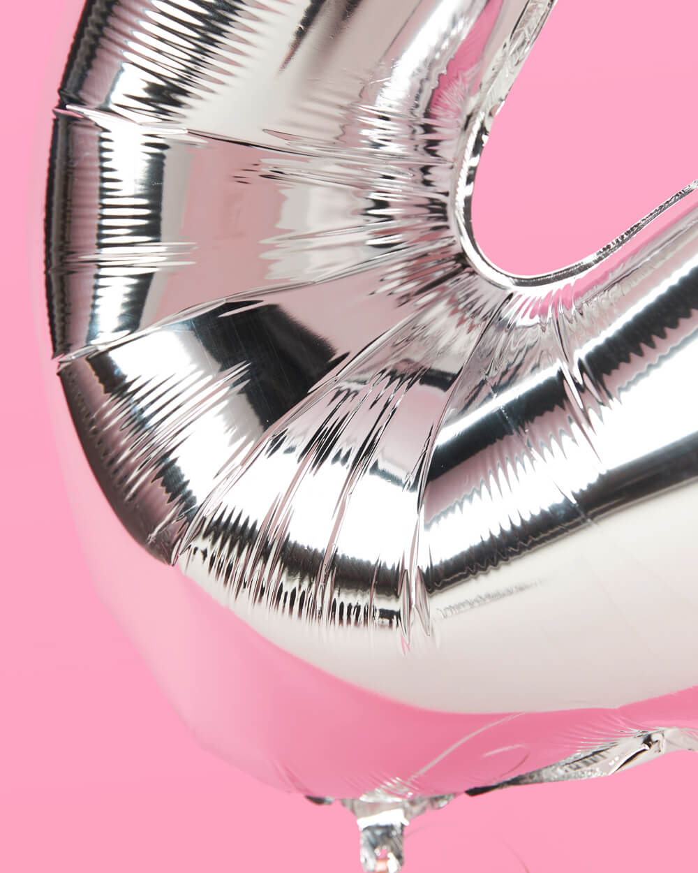 Close view of the silver foil finish on the 25th birthday number balloons