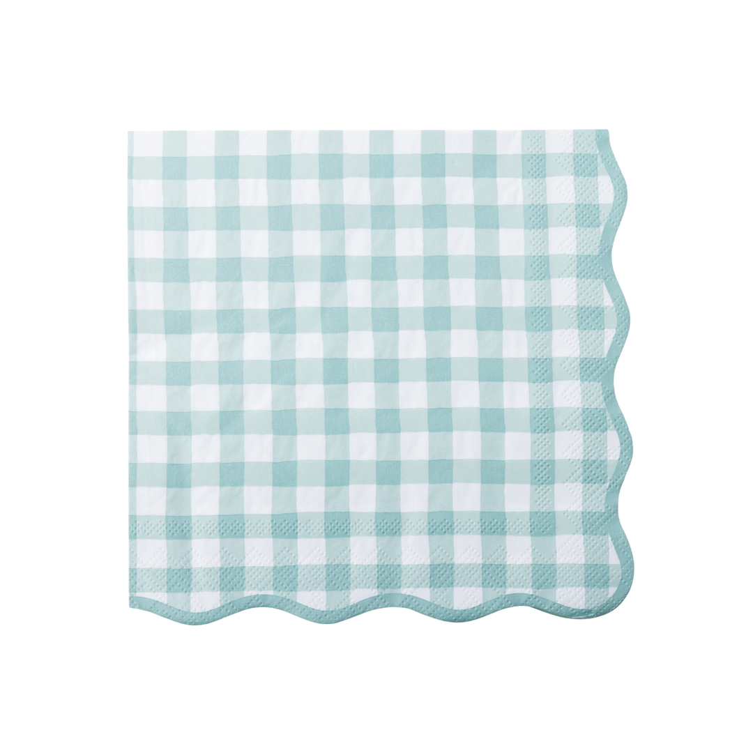 A stack of square paper napkins with a light sage and white gingham check pattern and scalloped edges, shown on a clean white background.