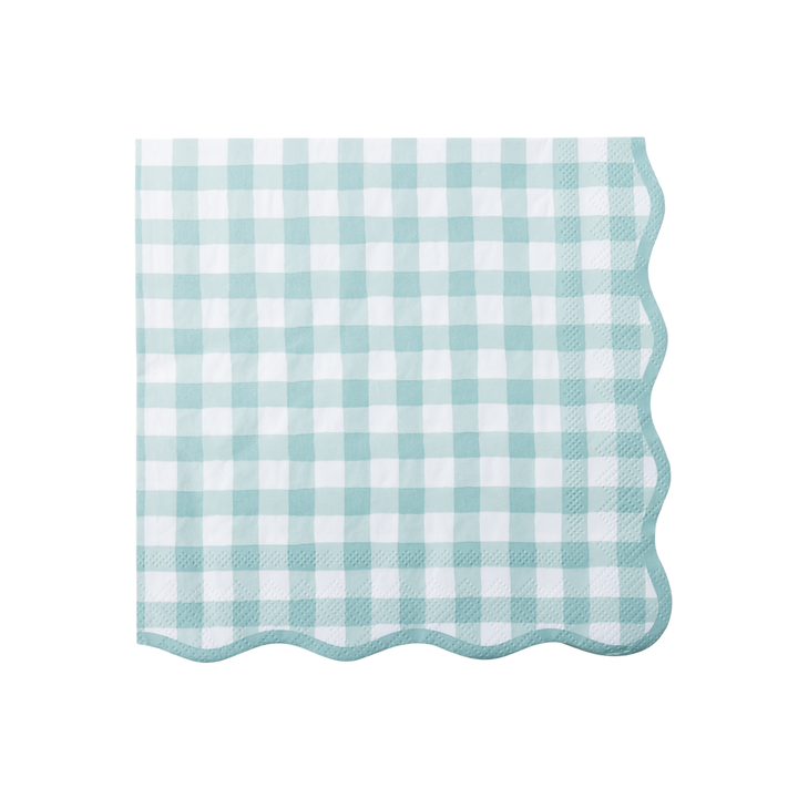 A stack of square paper napkins with a light sage and white gingham check pattern and scalloped edges, shown on a clean white background.