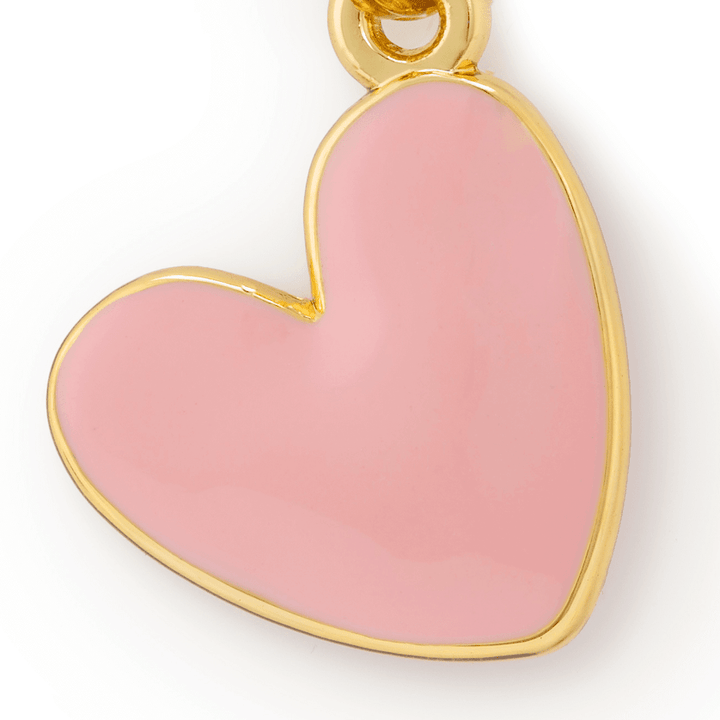 Close-up of the pink heart charm showing the glossy raised enamel and gold rim
