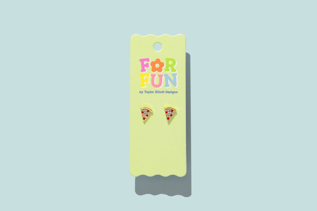 Two pizza slice stud earrings on a printed For Fun card against a pale blue background