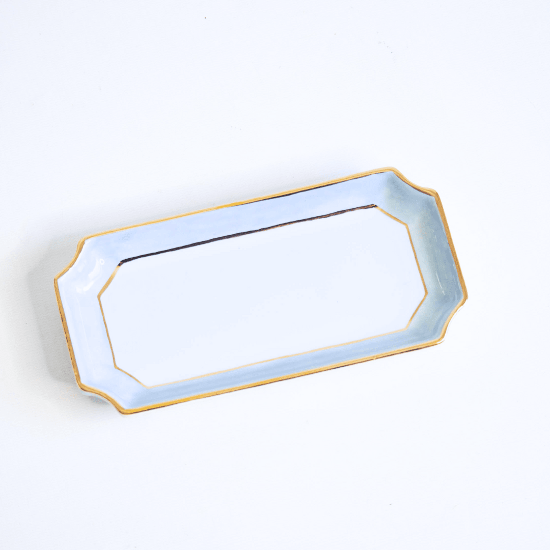 French blue petite valet tray on a white studio backdrop, product view of the gold rimmed dish for gifting
