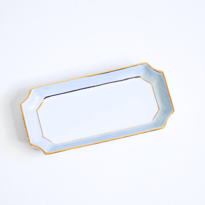 French blue petite valet tray on a white studio backdrop, product view of the gold rimmed dish for gifting