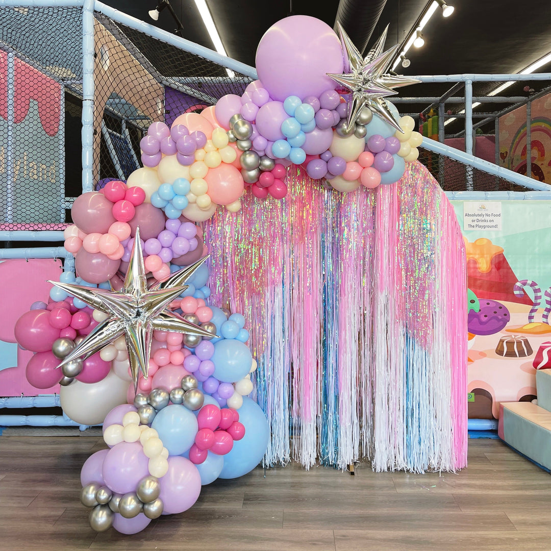 Pastel balloon garland with shimmer backdrop Frozen theme balloon decoration Frozen party decoration ideas - Los Angeles balloon installation