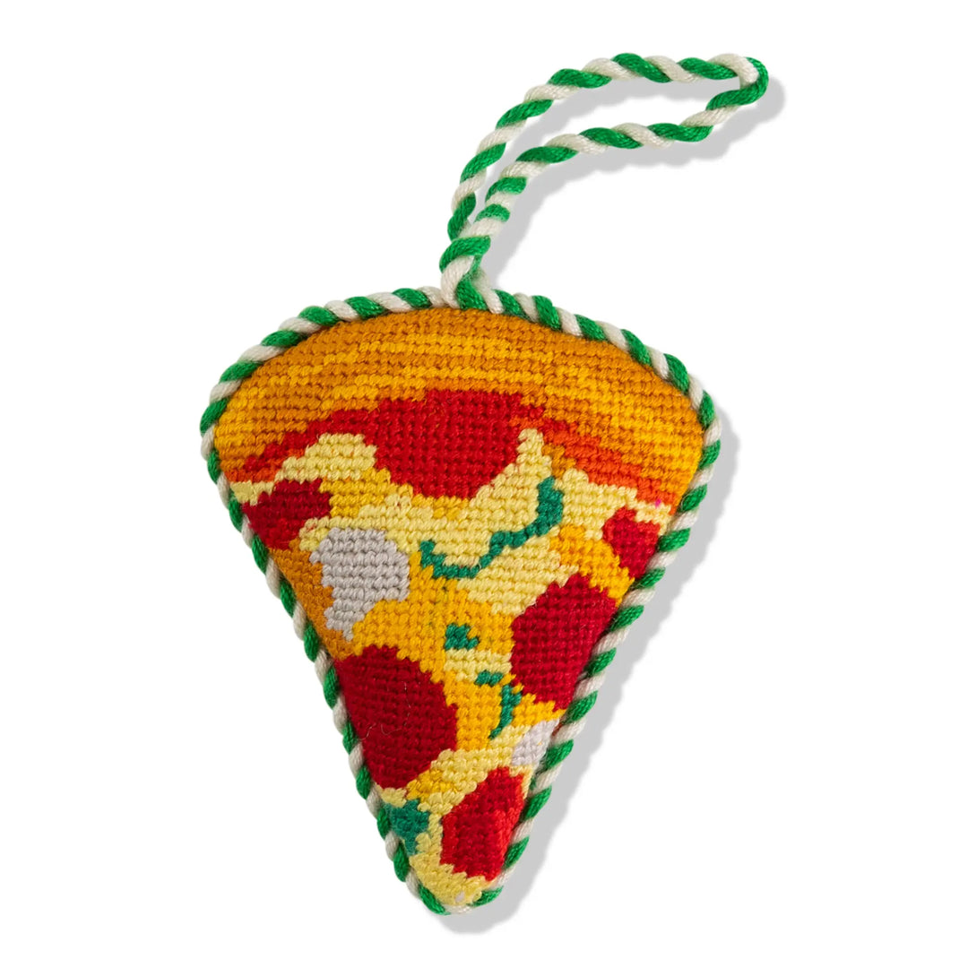 Pizza slice needlepoint ornament, front view with pepperoni, green flecks, golden crust, and green and white cord