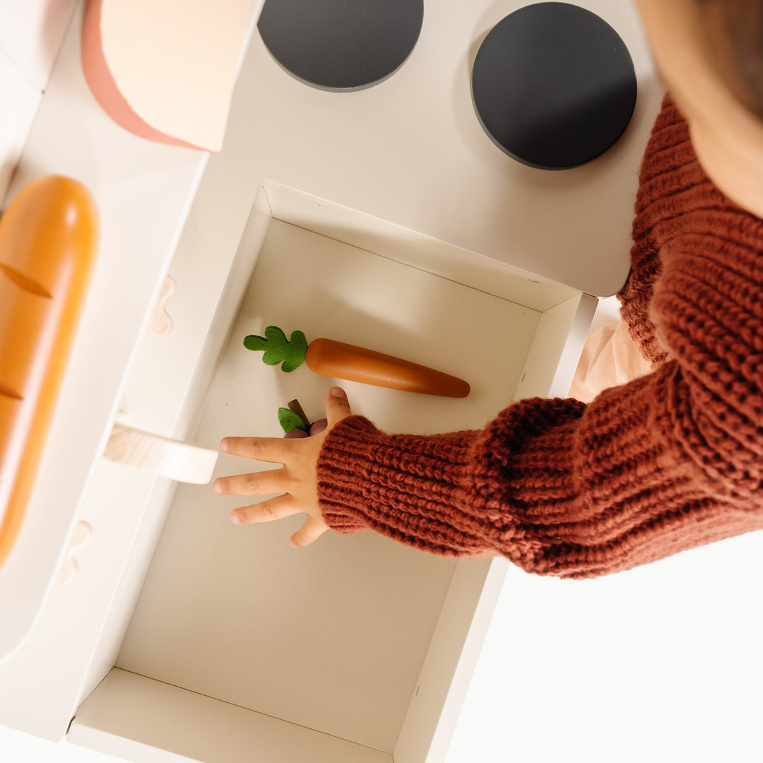 Gathre play kitchen styled with the wooden grocery set for pretend play.