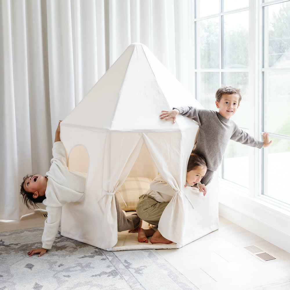 Gathre play tent styled in a modern neutral nursery.
