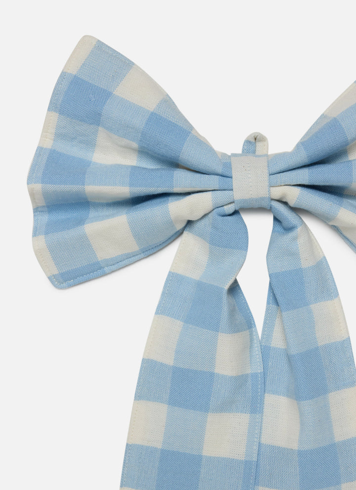 Close-up of the baby blue gingham check and the full loops of the cotton bow