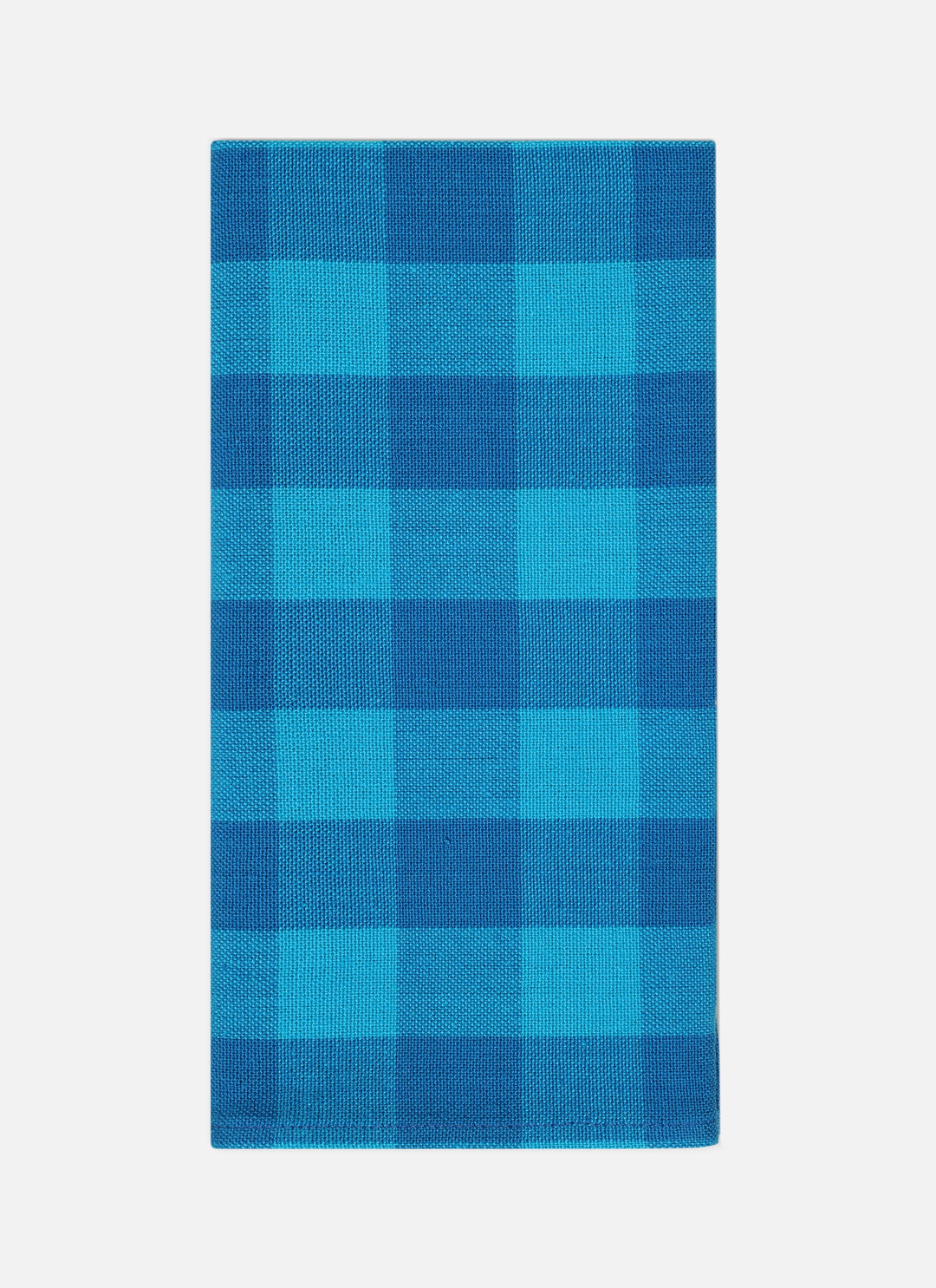 Gingham Zuma cloth napkin folded to show the two-tone turquoise handwoven check