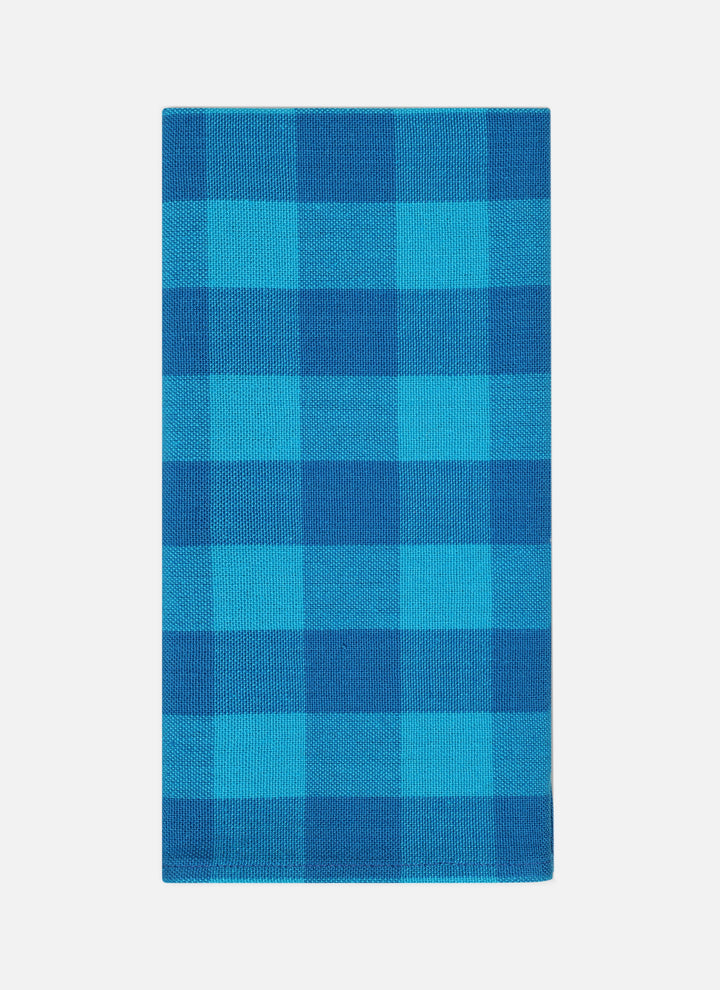 Gingham Zuma cloth napkin folded to show the two-tone turquoise handwoven check