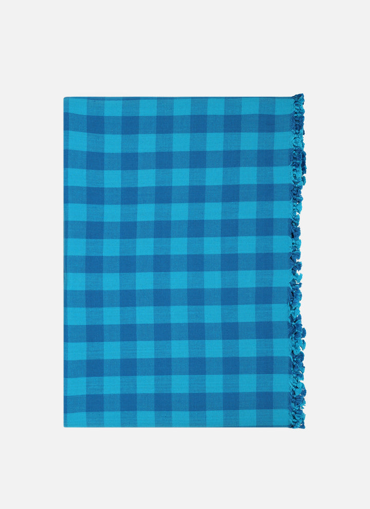 Gingham Zuma turquoise tablecloth folded to show the two-tone blue check