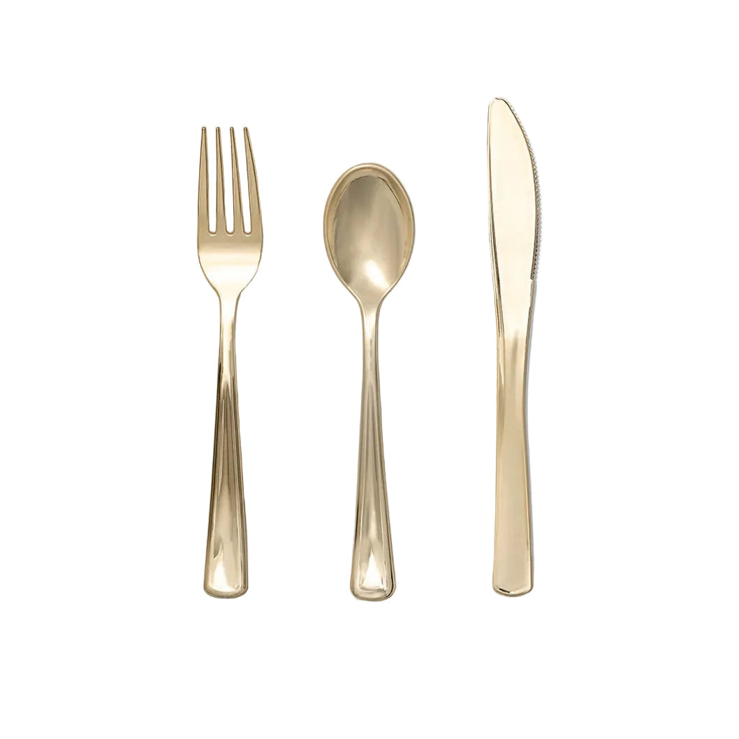 Set of gold fork, spoon, and knife on a white background