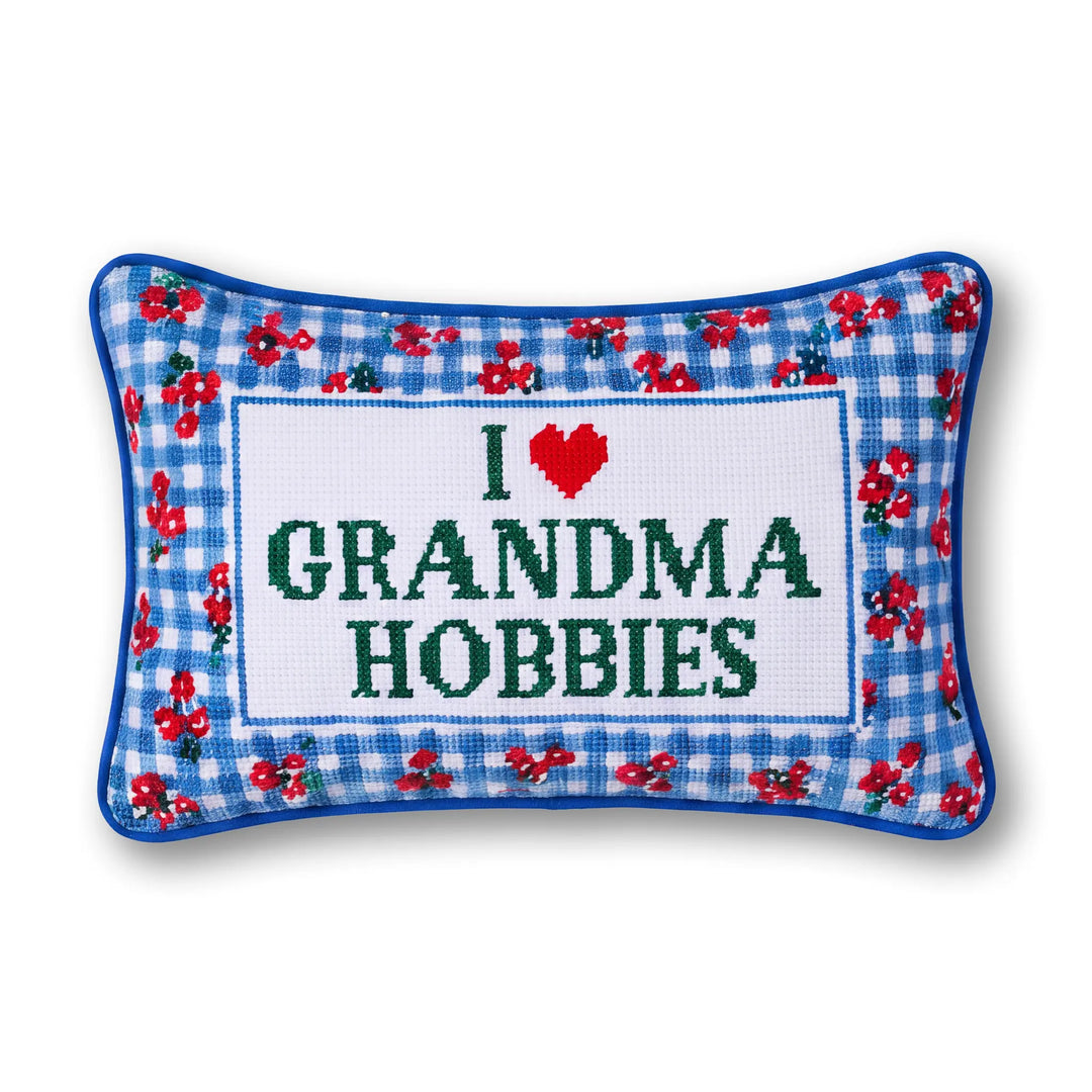 I Love Grandma Hobbies needlepoint lumbar pillow with a blue gingham and red floral border, front view