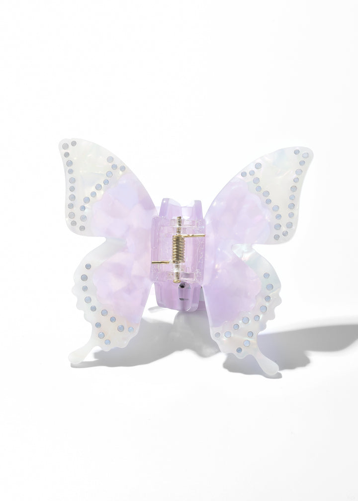Purple iridescent acrylic butterfly claw clip with dotted wing edges on a white background