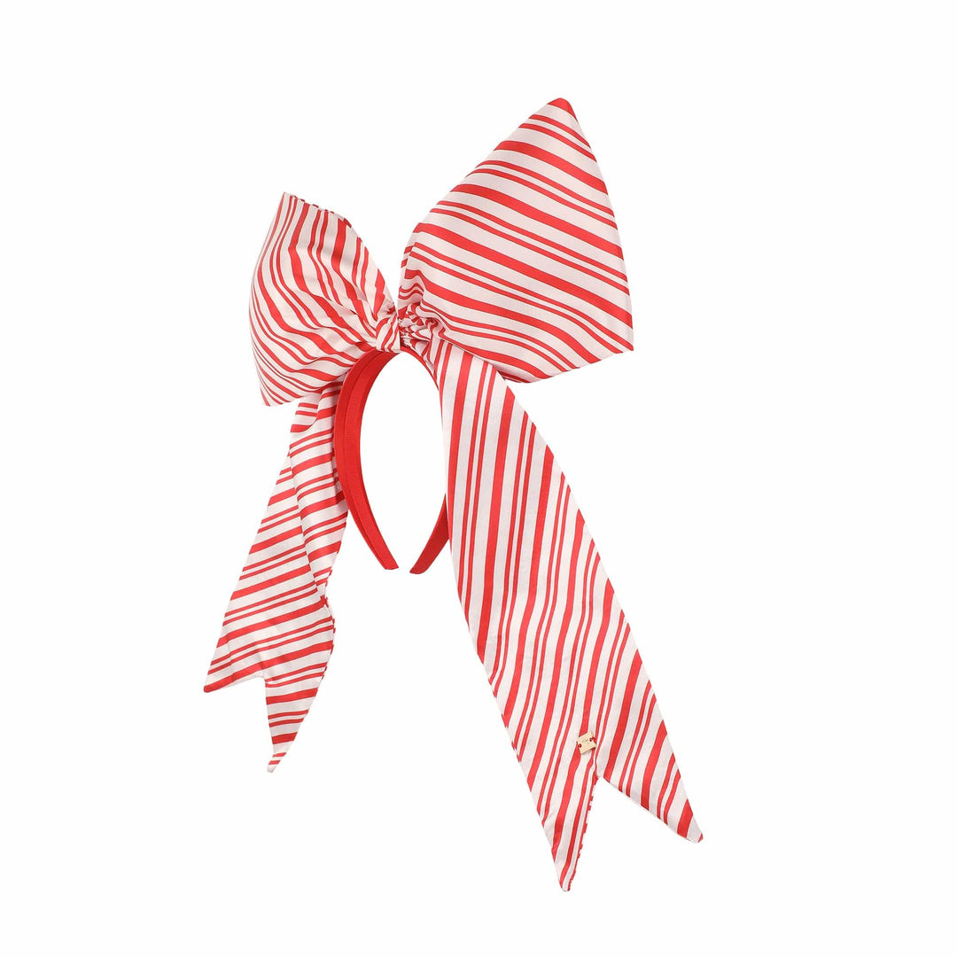 Side view of the jumbo striped bow headband showing the red headband