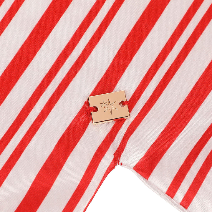 Close-up of the red and white striped satin with a Packed Party tag