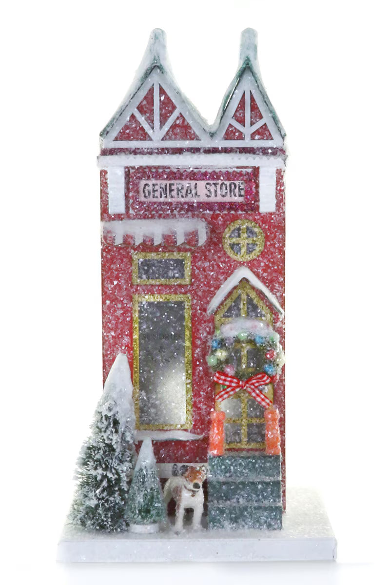 Red glitter paper General Store Christmas village shop with a dog and snowy bottle brush trees for holiday decor