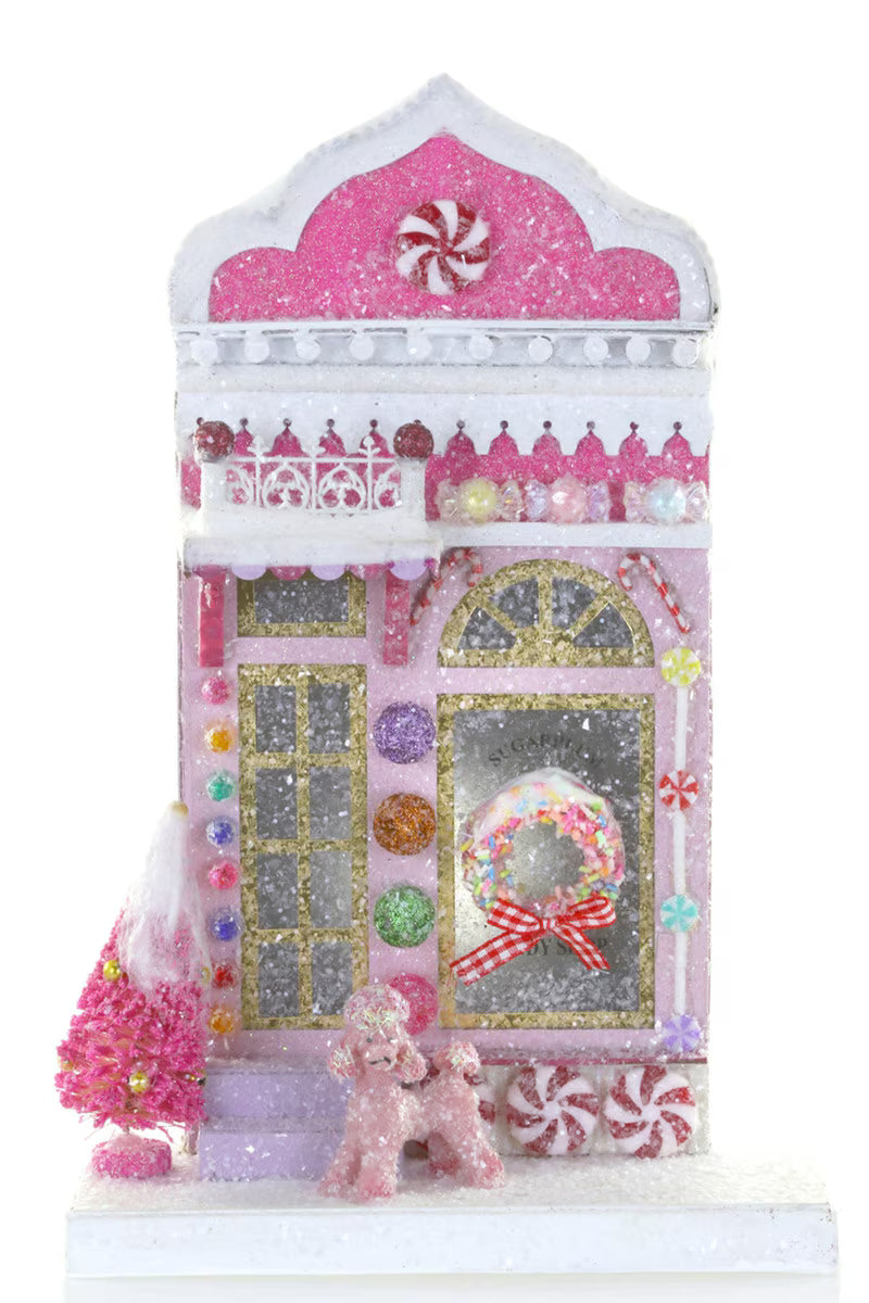 Pink glitter paper candy shop Christmas house with peppermints, candy canes, and a pink poodle for a holiday village
