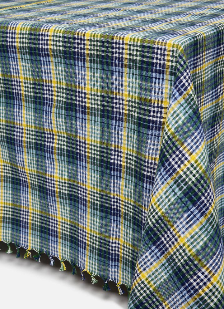 Maine plaid tablecloth draped over a table showing the tasseled edge and multicolor check