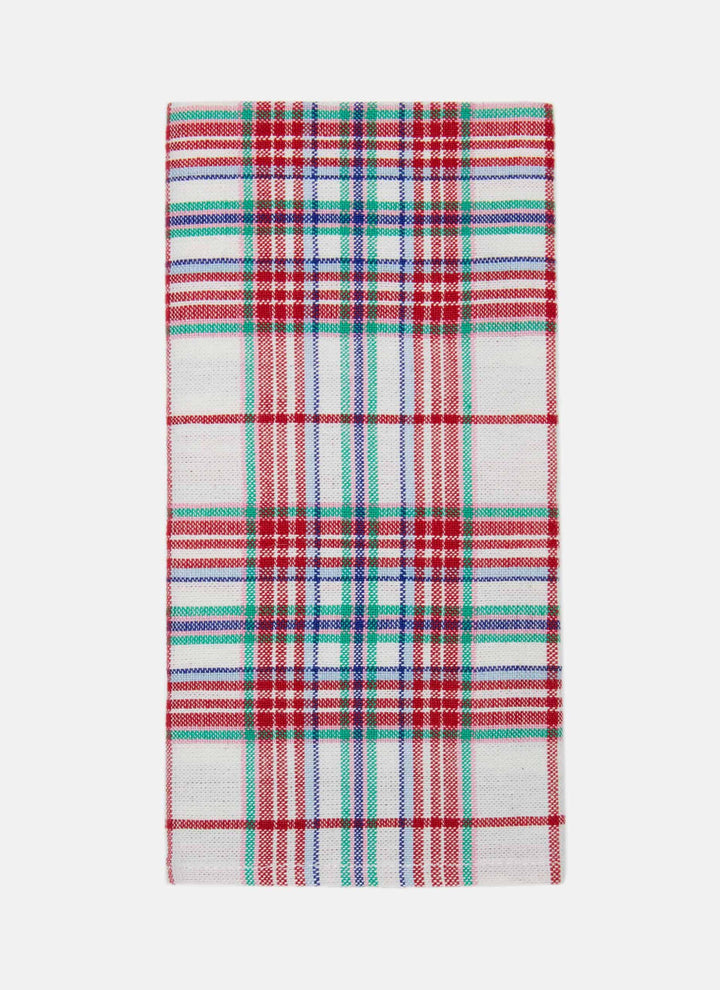 Clara plaid cloth napkin flat on white, red, green, and blue plaid on a cream cotton weave