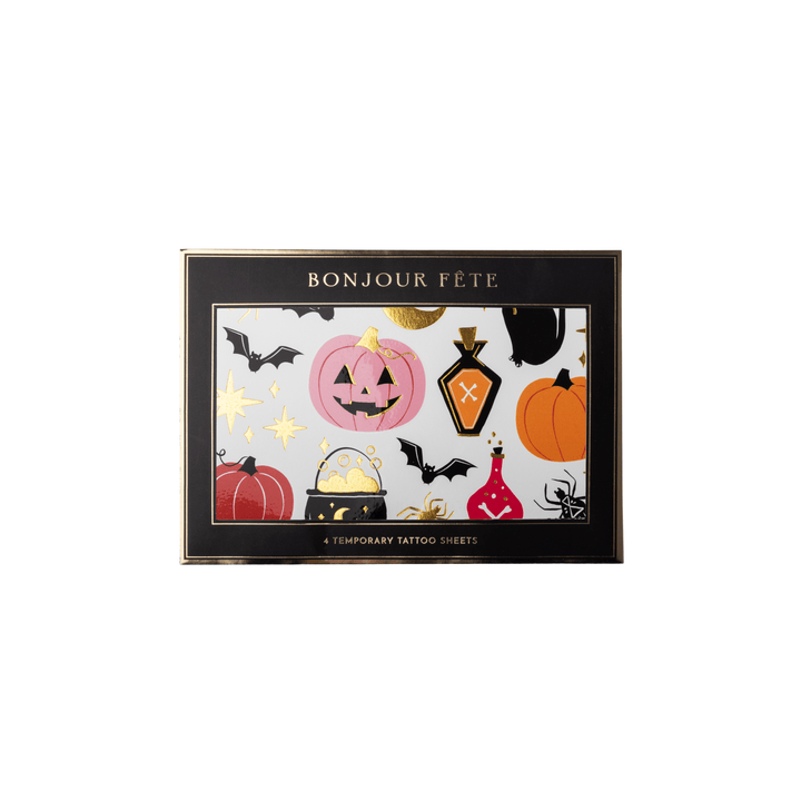 A set of Halloween-themed temporary tattoo sheets. The black rectangular box has gold trim and the text 'BONJOUR FETE' at the top, with a colorful front panel showing pumpkins, bats, a cauldron, a potion bottle, a spider, and gold stars on a white background.