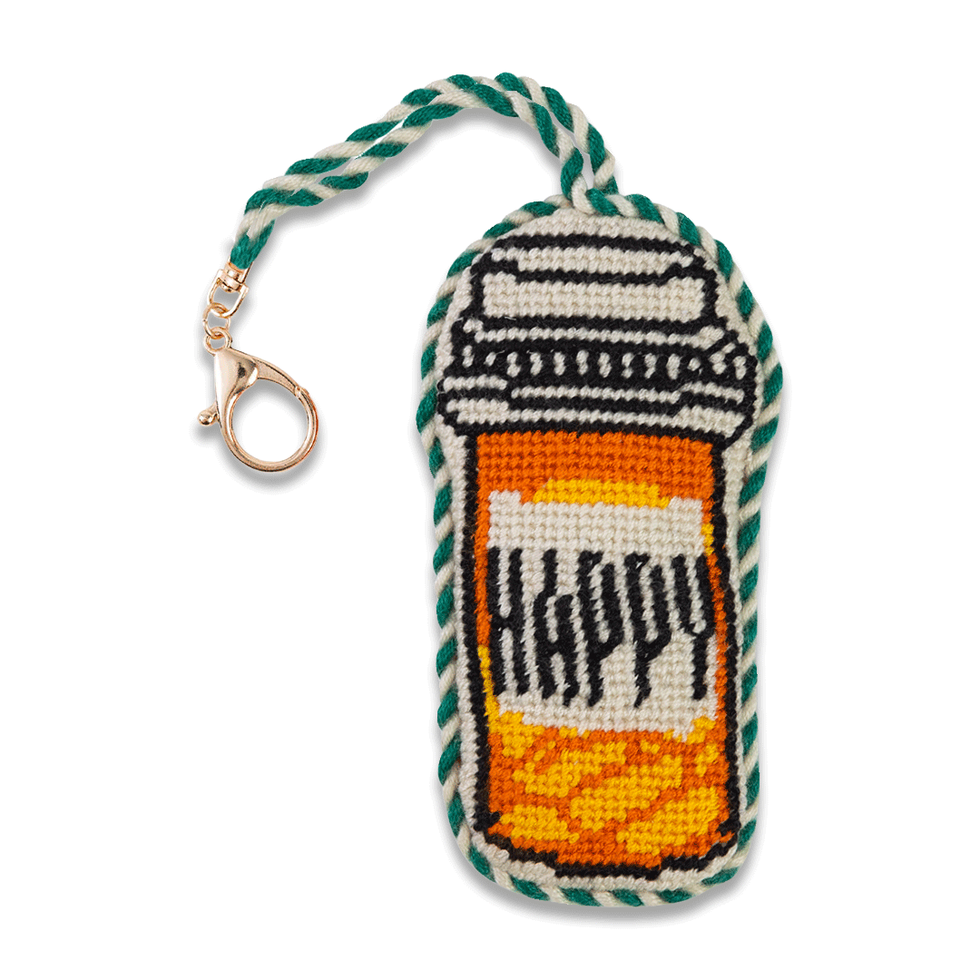 Needlepoint happy pills bag charm with a lobster clasp