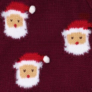 Close-up of red-hatted Santa faces with fluffy white beards knitted into burgundy fabric.