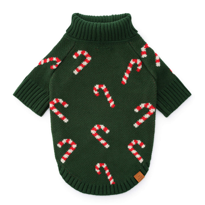 Dark green knit dog sweater flat from the back, scattered with red and white candy canes, on white