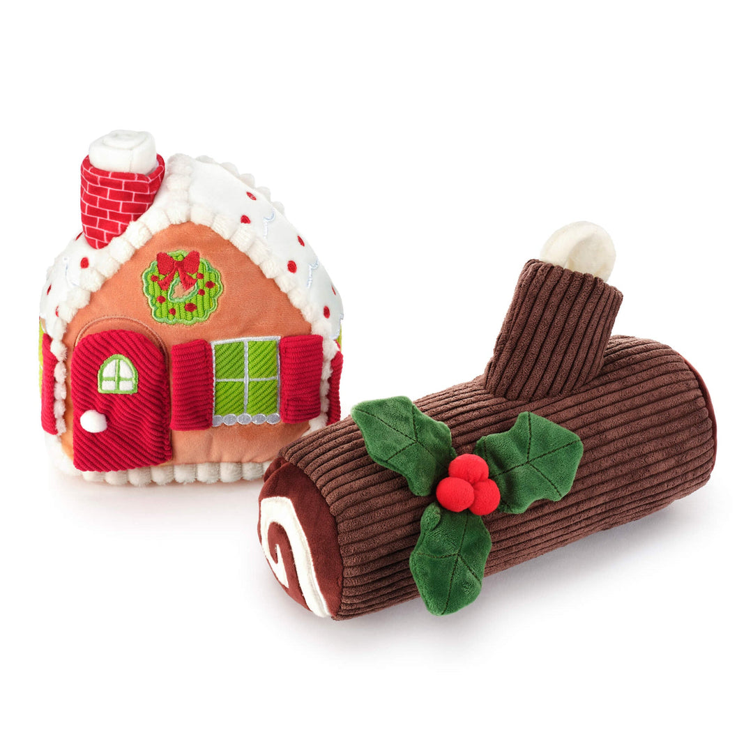 Gingerbread house dog toy and corduroy yule log dog toy side by side on white