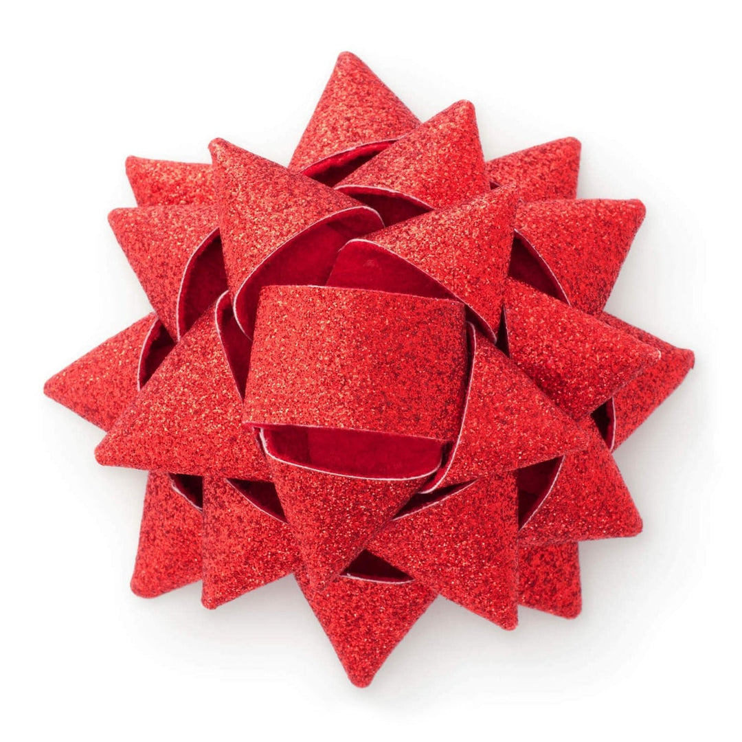 Front close-up of a red glitter gift bow with layered pointed loops on a white background.