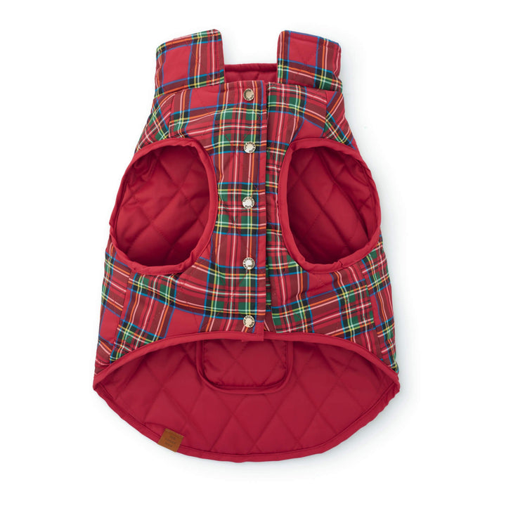 Tartan quilted dog jacket laid flat with gold snap closures, broad armholes, and red lining.