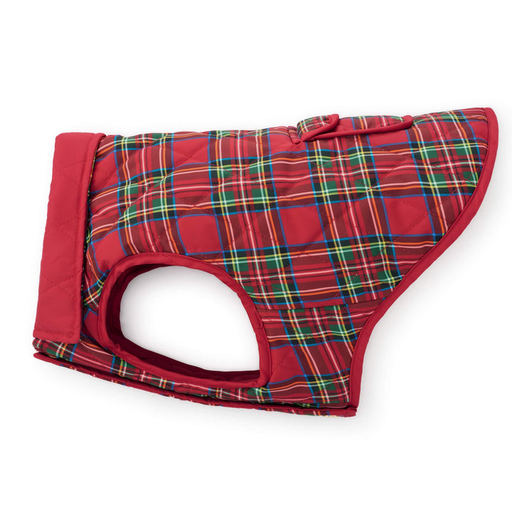 Side profile of a red tartan dog jacket with red binding and a folded-back solid red collar.