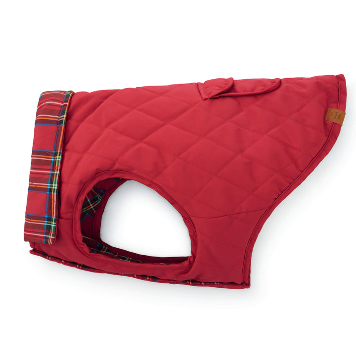 Side profile of the jacket's plain red quilted reverse with tartan collar and snap pocket.