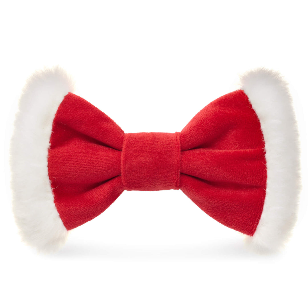 Red Santa dog bow tie with white faux fur trim on both wings, front view on white