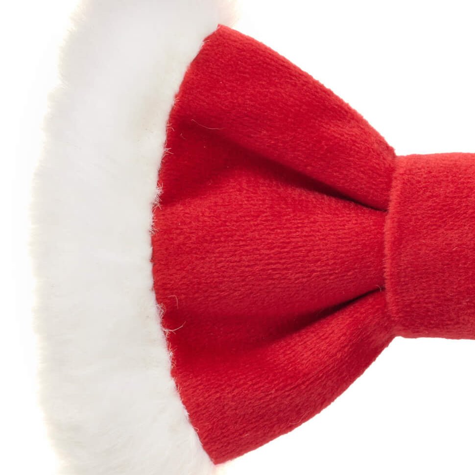 Close-up of the red bow tie edge with fluffy white Santa hat trim