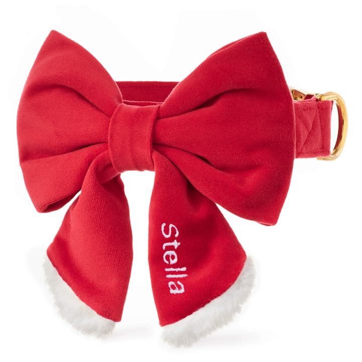 Red Santa Paws collar and sailor bow with white fluffy trim, sample name embroidered on the tail