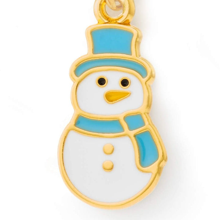 Close-up of the snowman charm showing the carrot nose, coal eyes, and gold outline