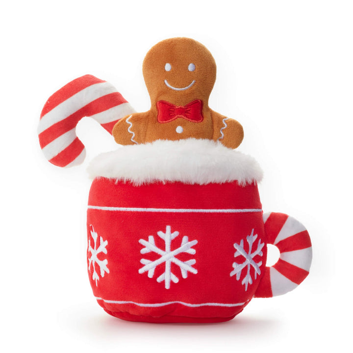 Red plush hot cocoa mug dog toy with snowflakes, gingerbread man, and candy cane on white