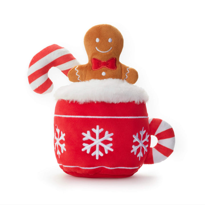 Close front view of the hot cocoa dog toy with gingerbread man and candy cane on white