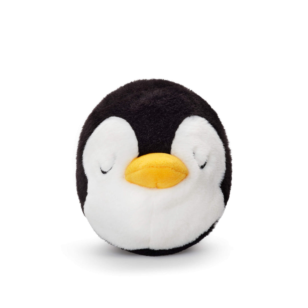 Round black-and-white penguin dog toy with closed eyes and a yellow beak on white.