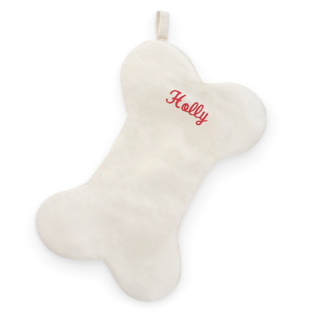 Ivory velvet bone-shaped dog Christmas stocking with a hanging loop, plain with no embroidery