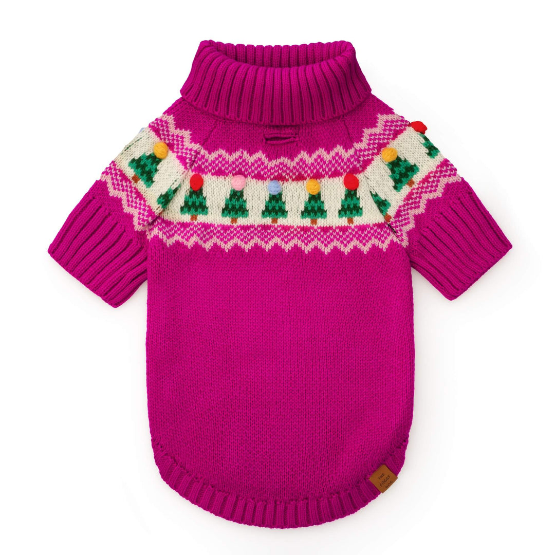 Magenta Fair Isle dog sweater laid flat, with green trees and colorful bobbles around the shoulders.