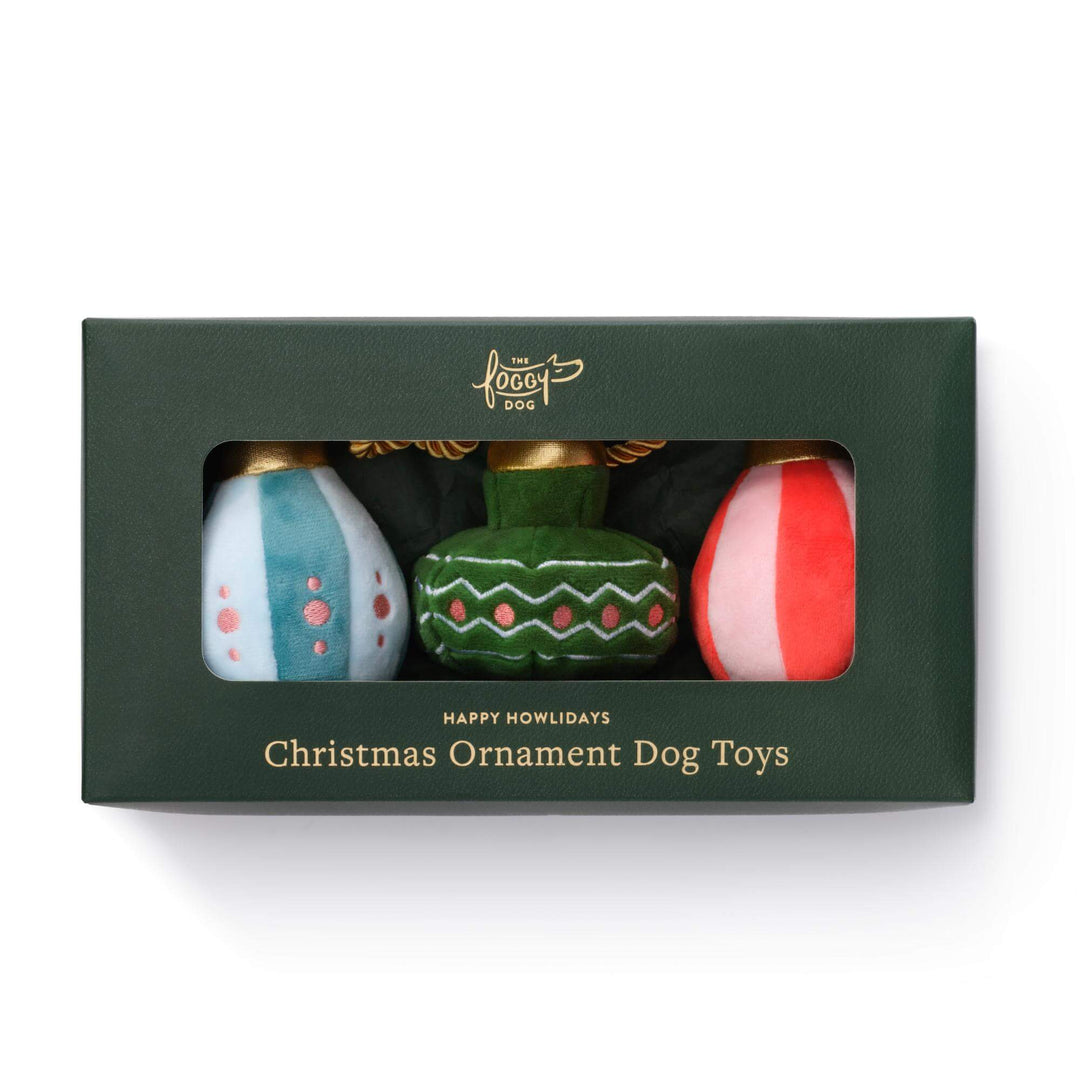 Second front view of the boxed Christmas ornament dog toy set on white