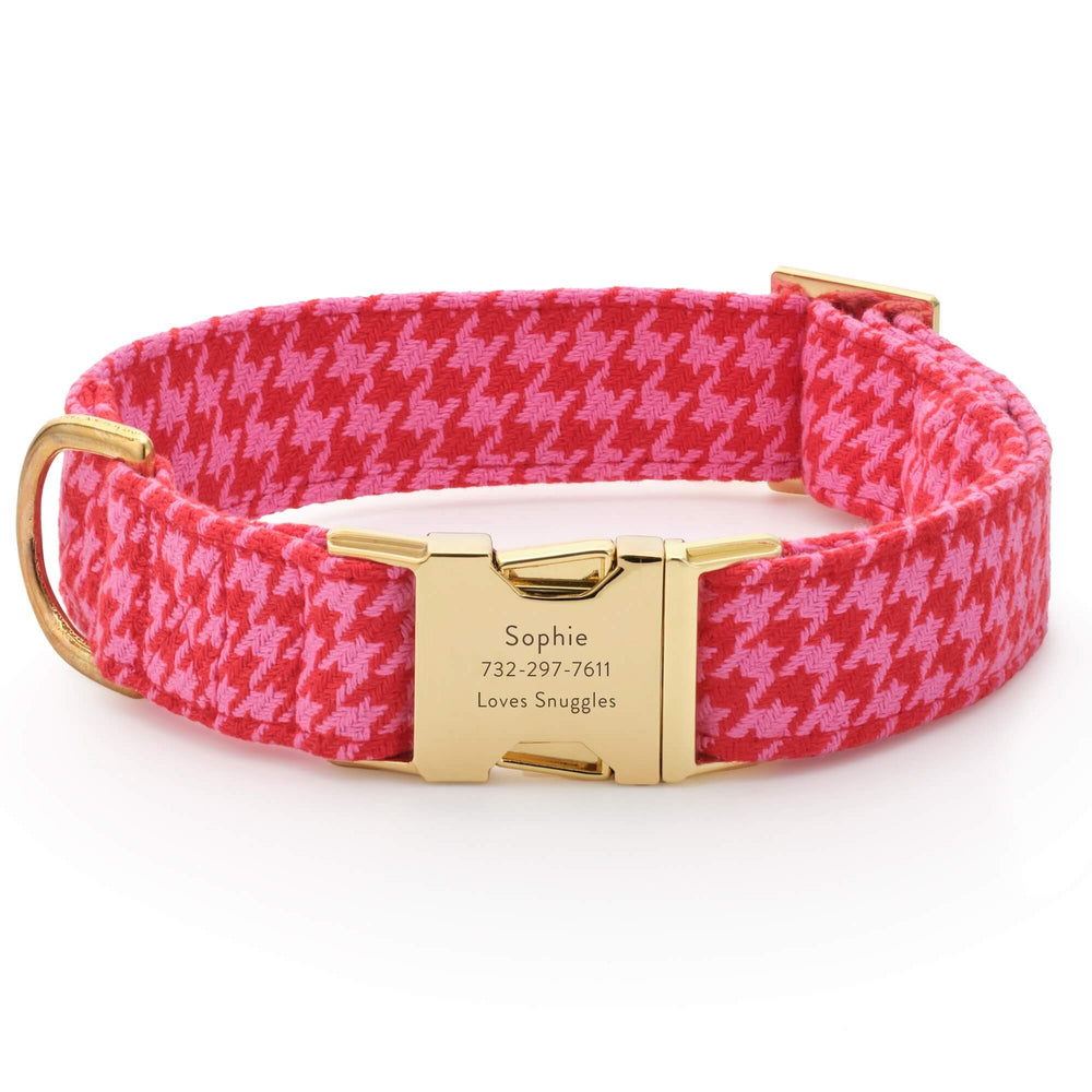 Engraved sample buckle on the pink and red houndstooth collar, showing the personalization option